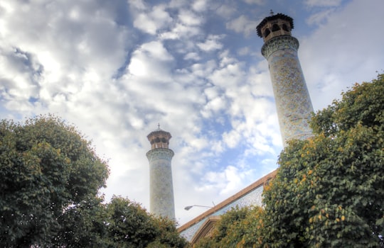 white concrete tower under blue sky and white clouds during daytime in Qazvin Province Iran