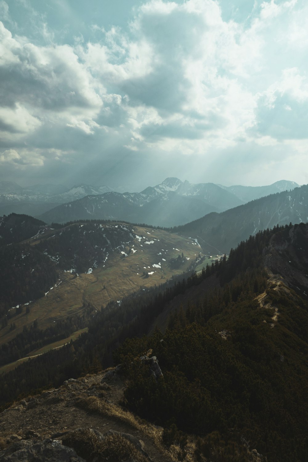 green and brown mountains under white clouds during daytime