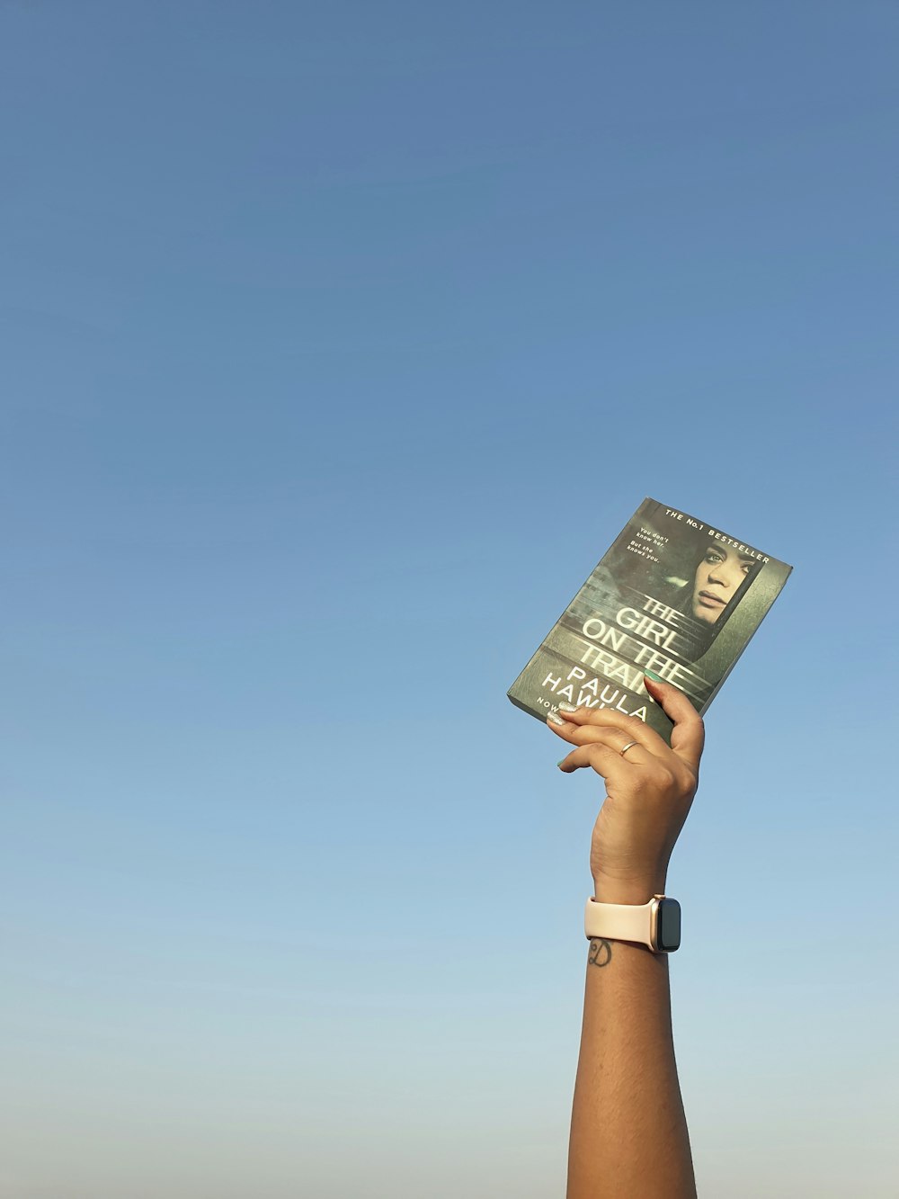 person holding a newspaper during daytime