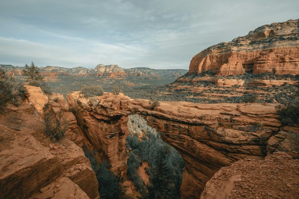 Brown rocky mountain under white cloudy sky during daytime — Sedona, United States