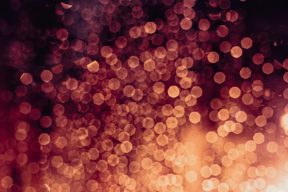 orange and white bokeh lights