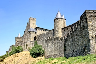 grey concrete castle under blue sky during daytime