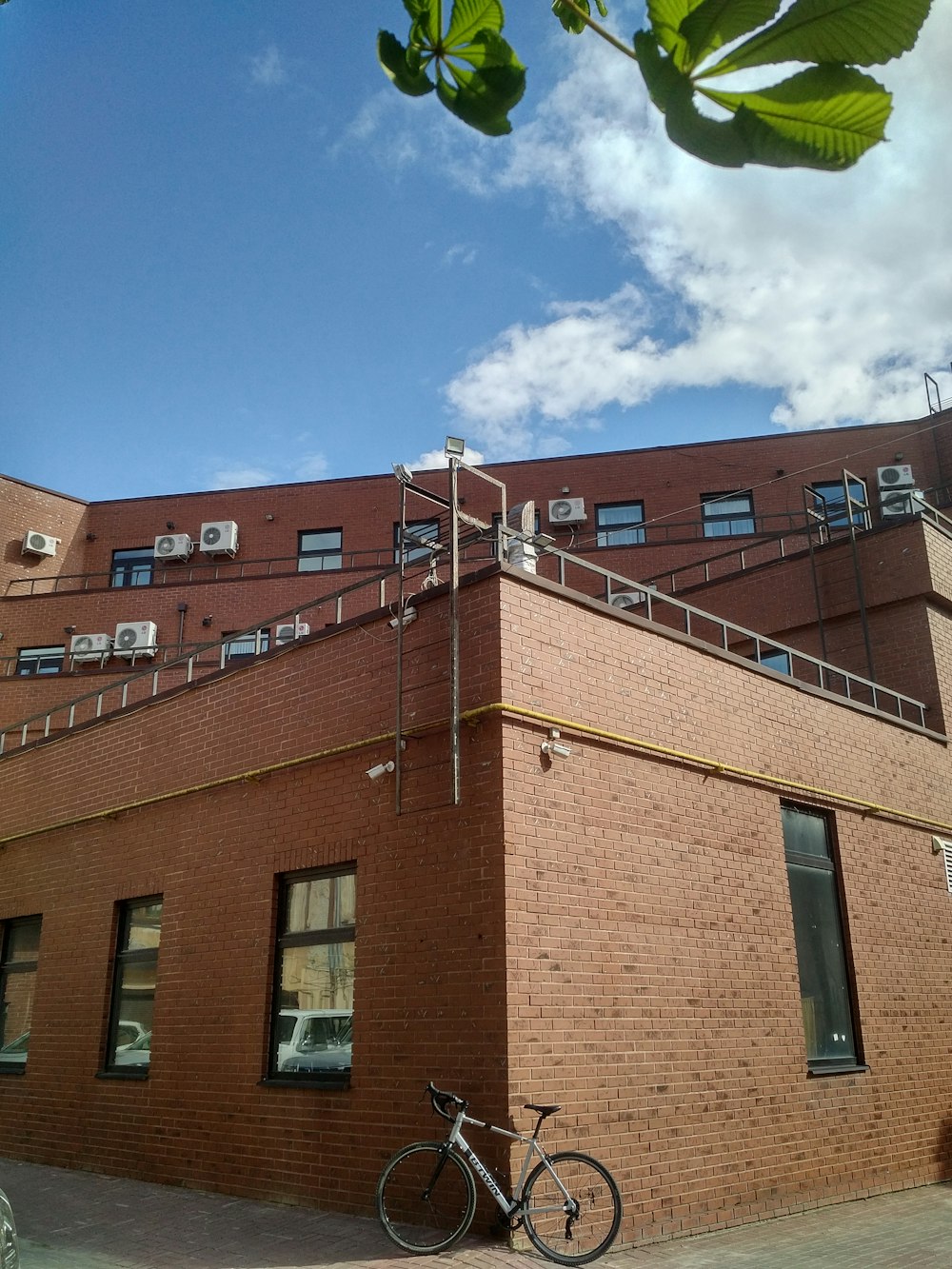 brown brick building under blue sky during daytime