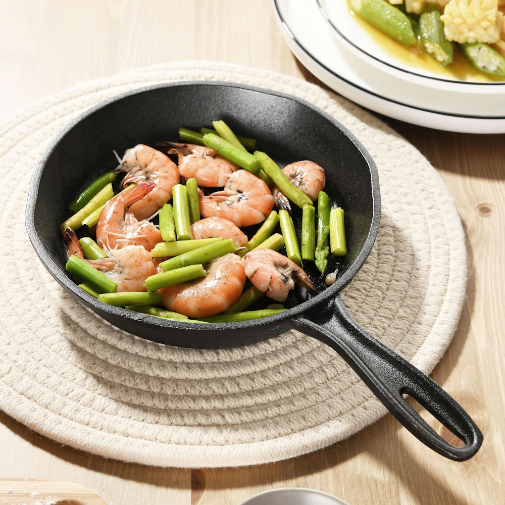 black ceramic bowl on white table cloth