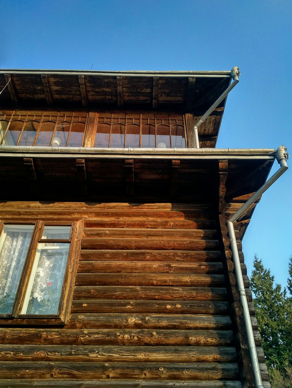 brown wooden framed glass window