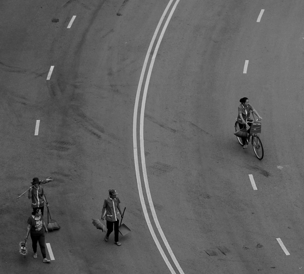 grayscale photo of people walking on street