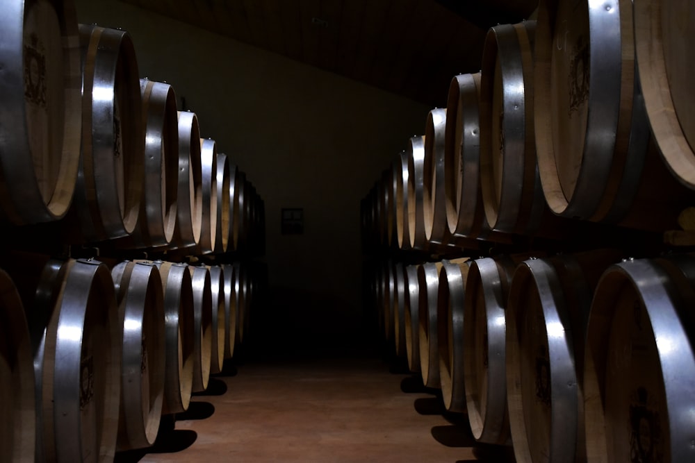 brown wooden barrels on brown wooden floor