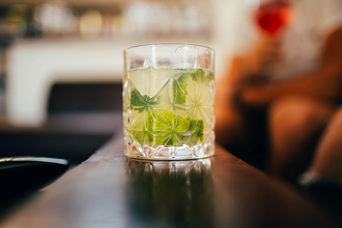 Botanical mocktail with fresh herbs and citrus in elegant glassware