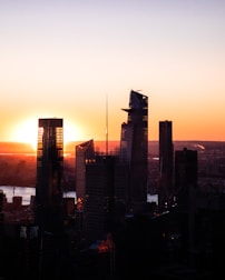 City skyline featuring commercial buildings during sunset.