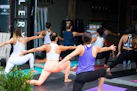 Group fitness class exercising together in a studio