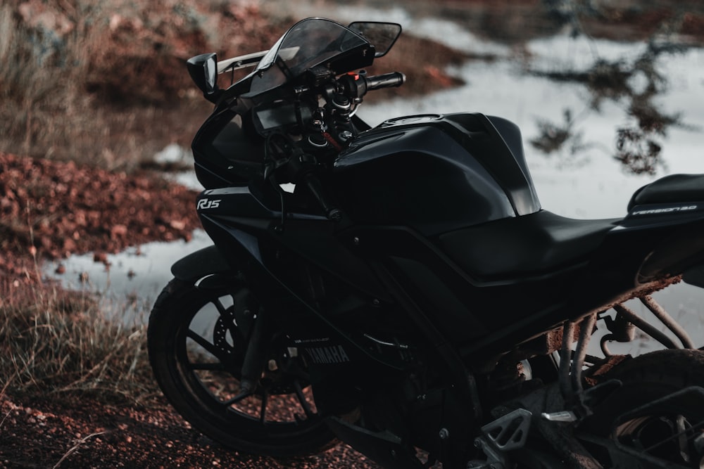 black motorcycle on brown dirt