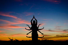 silhouette of person jumping during sunset