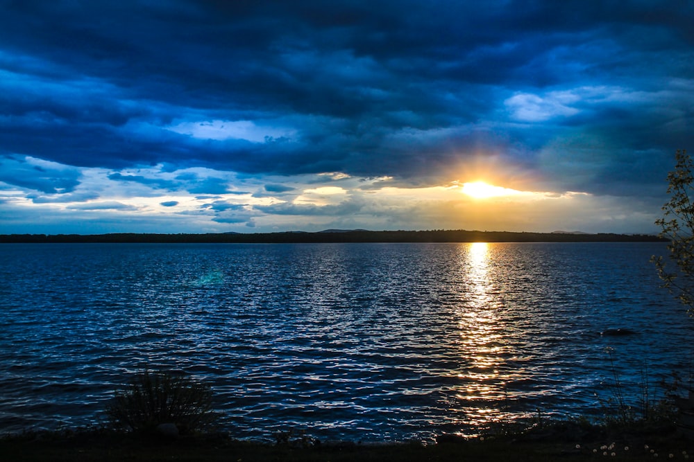 body of water under blue sky during daytime