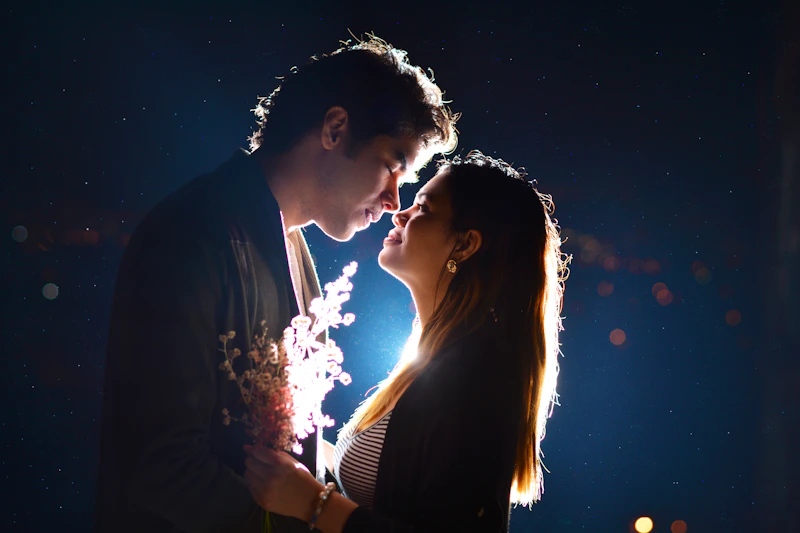 couple sharing a night-time kiss