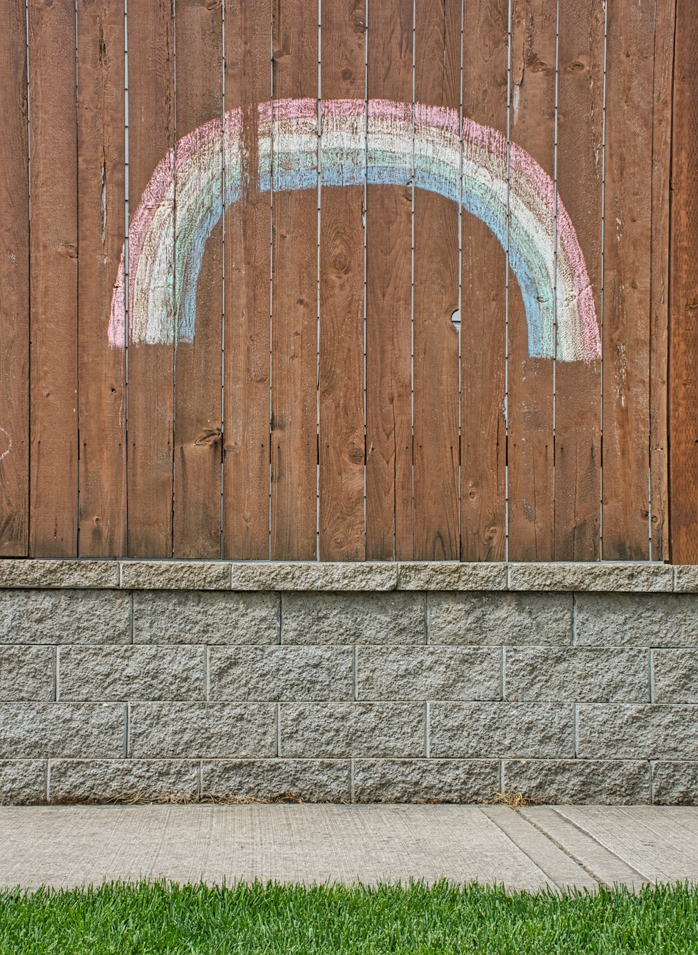 brown wooden door with blue and white heart shaped hole