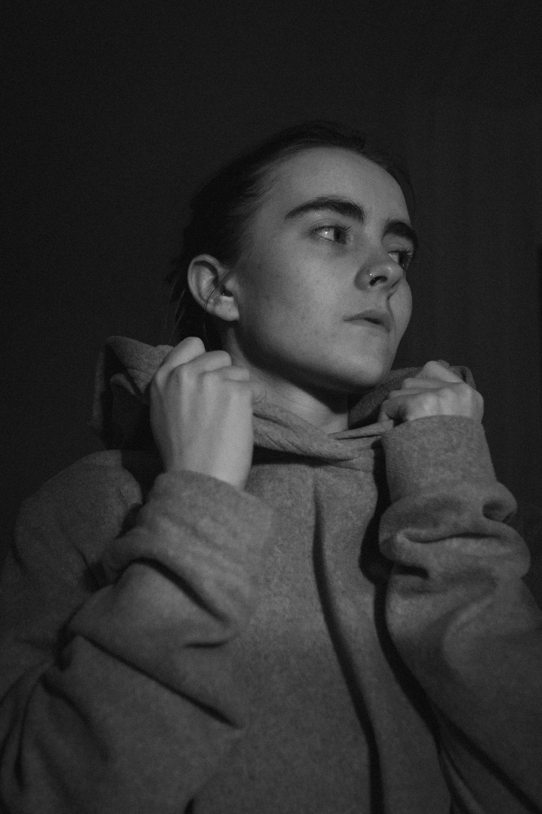 grayscale photo of woman in long sleeve shirt