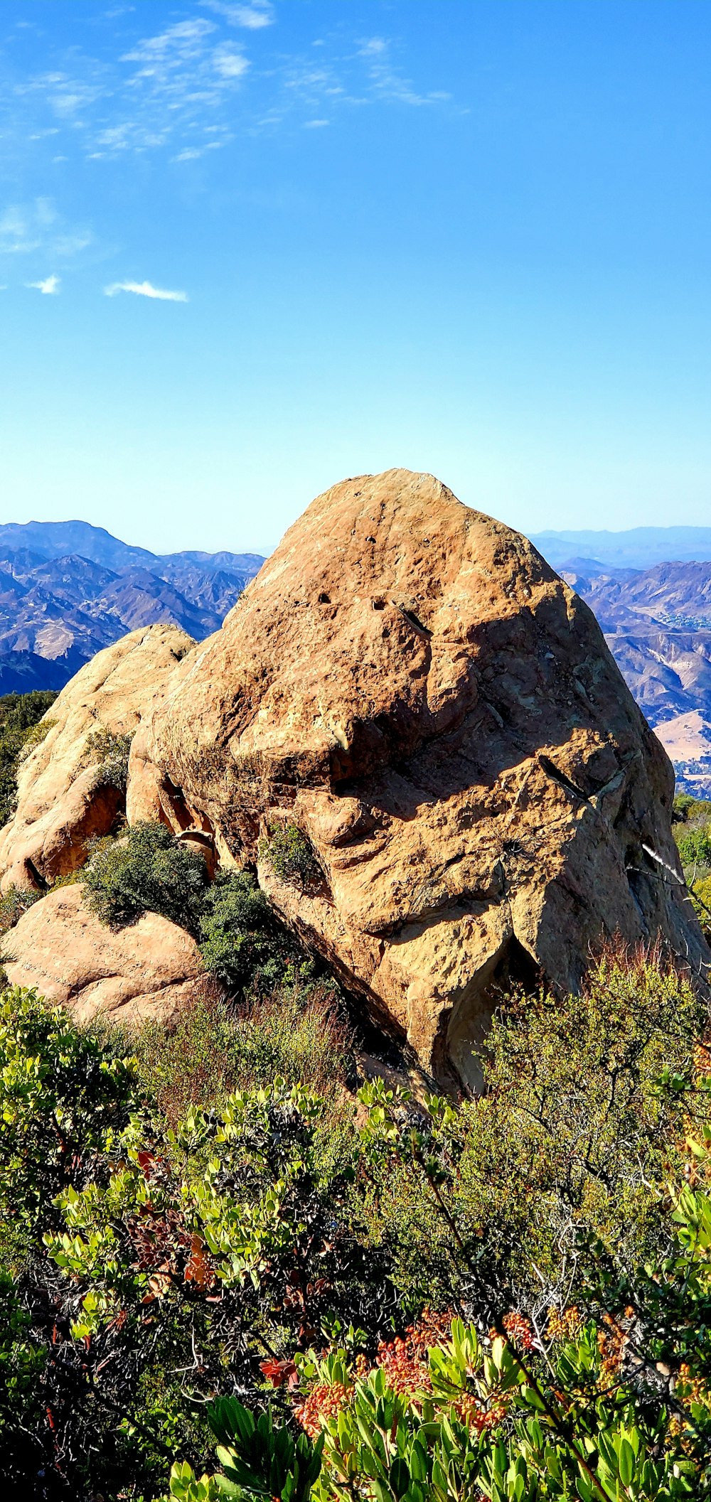 brown rocky mountain under blue sky during daytime