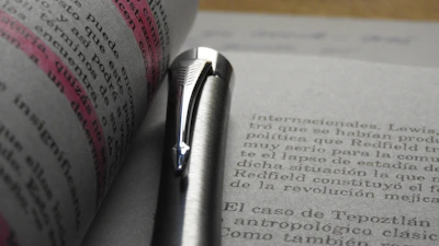 Close-up of a student highlighting key points in a psychology workbook.
