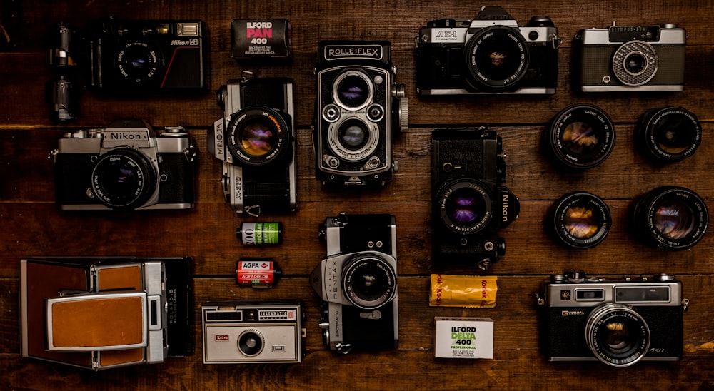 black and silver camera on brown wooden table