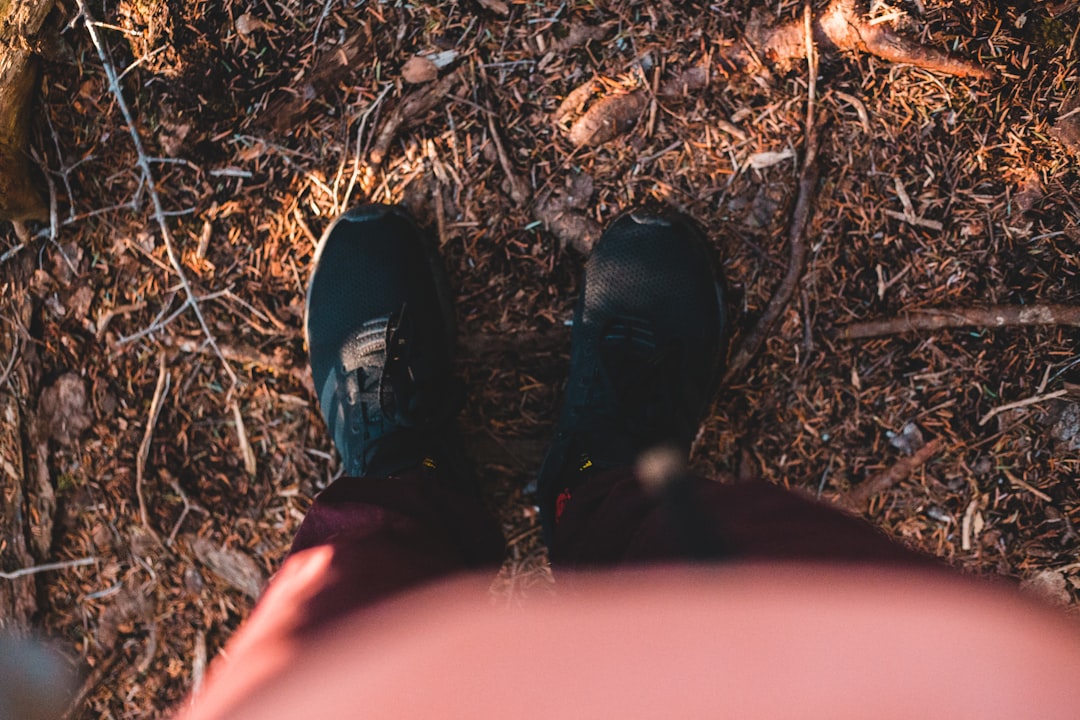 person in black leather shoes