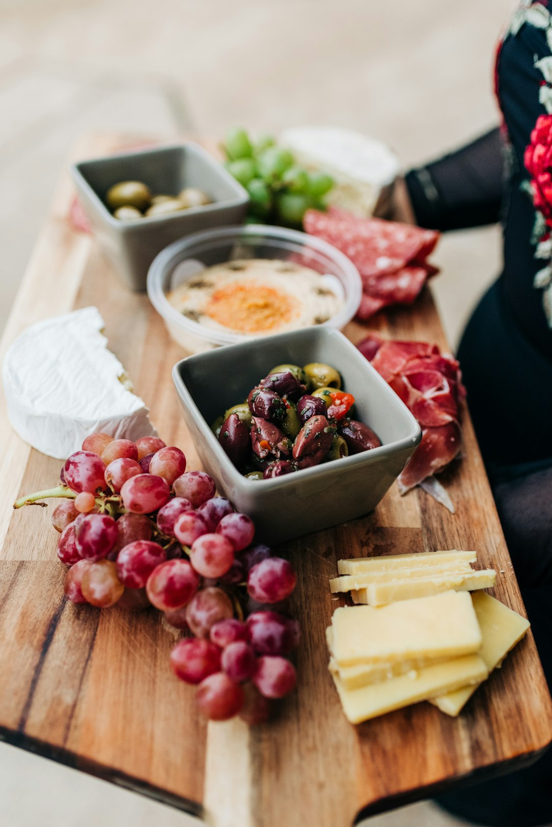 sliced cheese on brown wooden chopping board