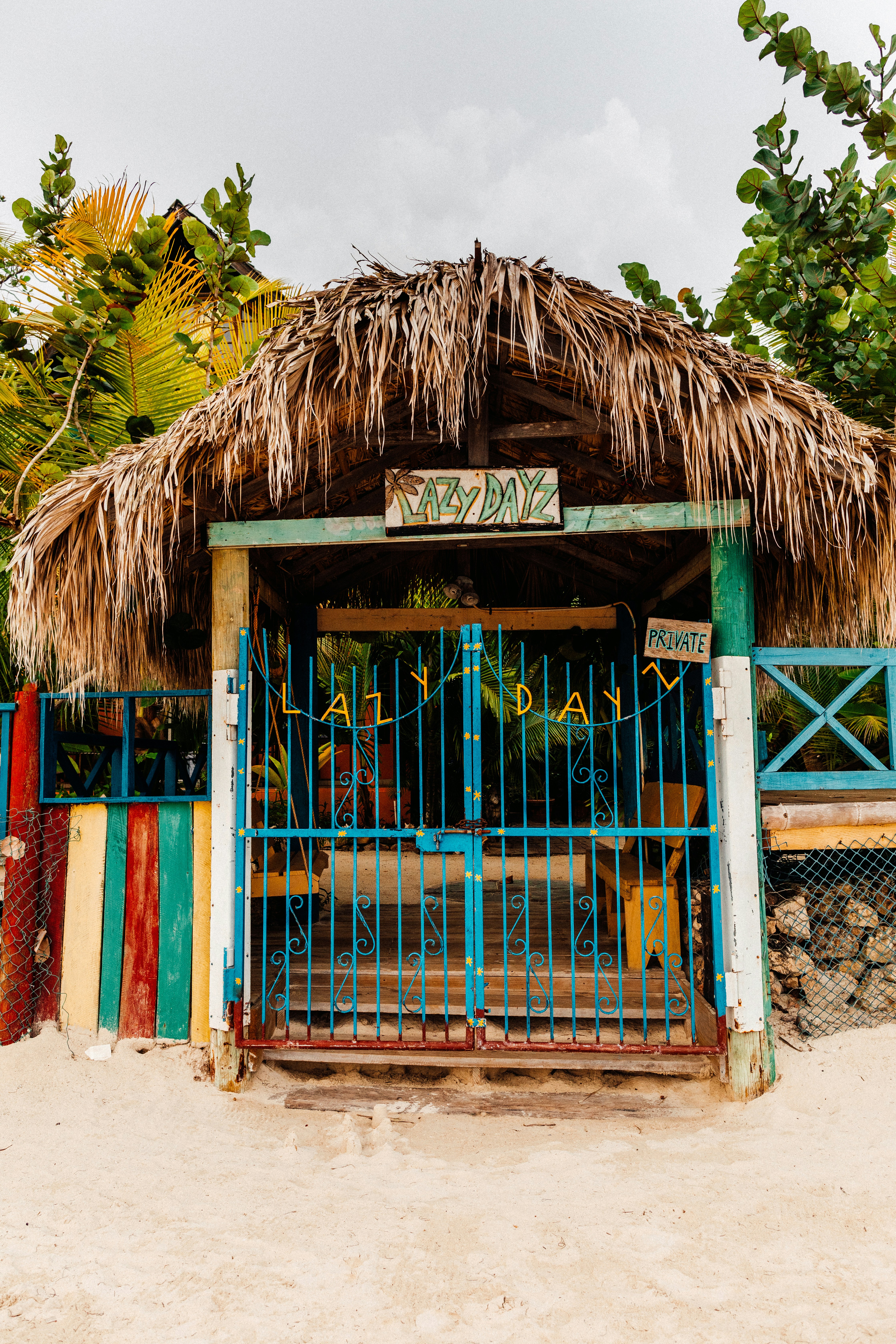 brown wooden house with blue wooden door