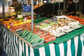 Close-up of fresh, colorful produce arranged at a local farmer's market stall.
