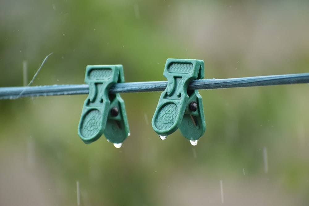 black metal fence with water droplets