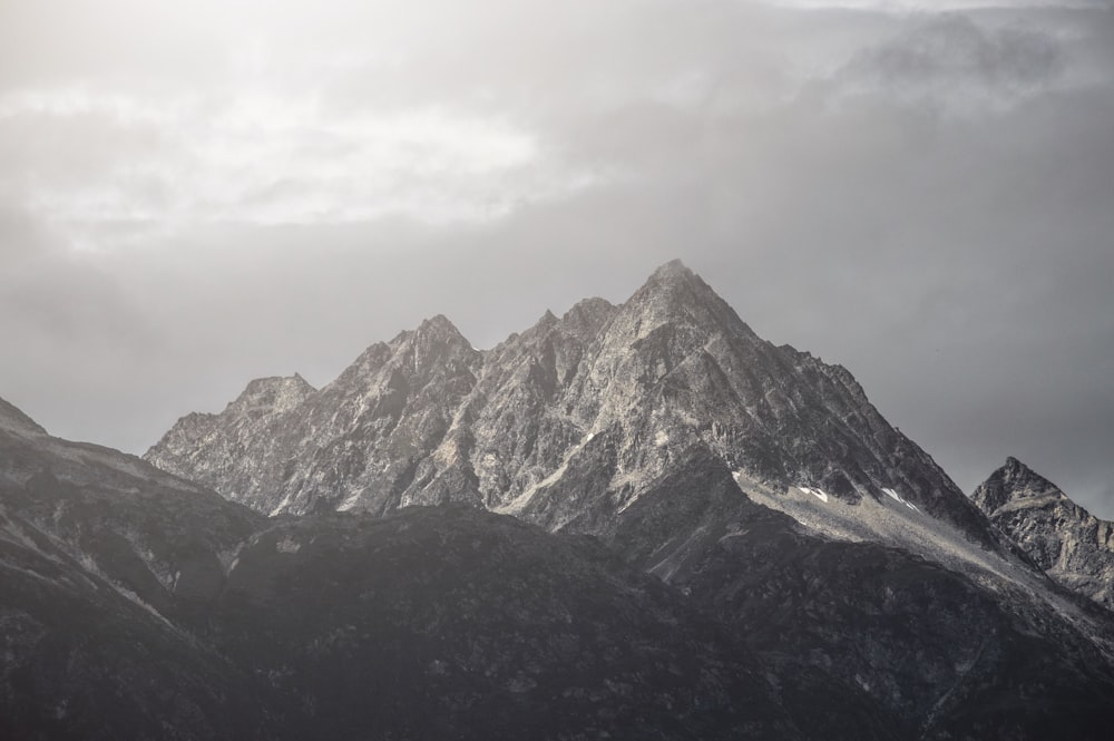 gray and white mountain under white clouds during daytime