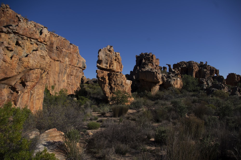 brown rock formation under blue sky during daytime