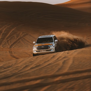 white chevrolet car on desert