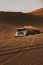white chevrolet car on desert