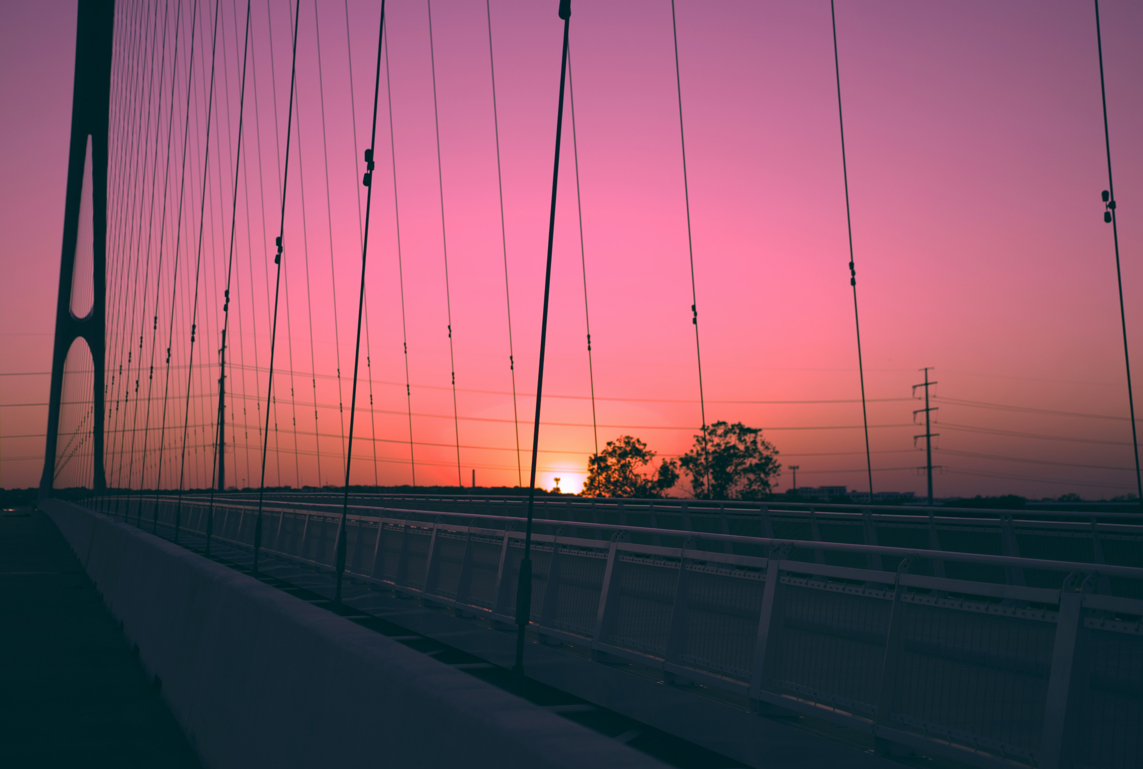 black metal bridge under blue sky during daytime