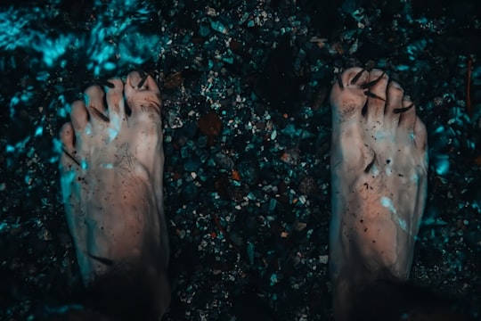 persons feet on water in Cuilco Guatemala
