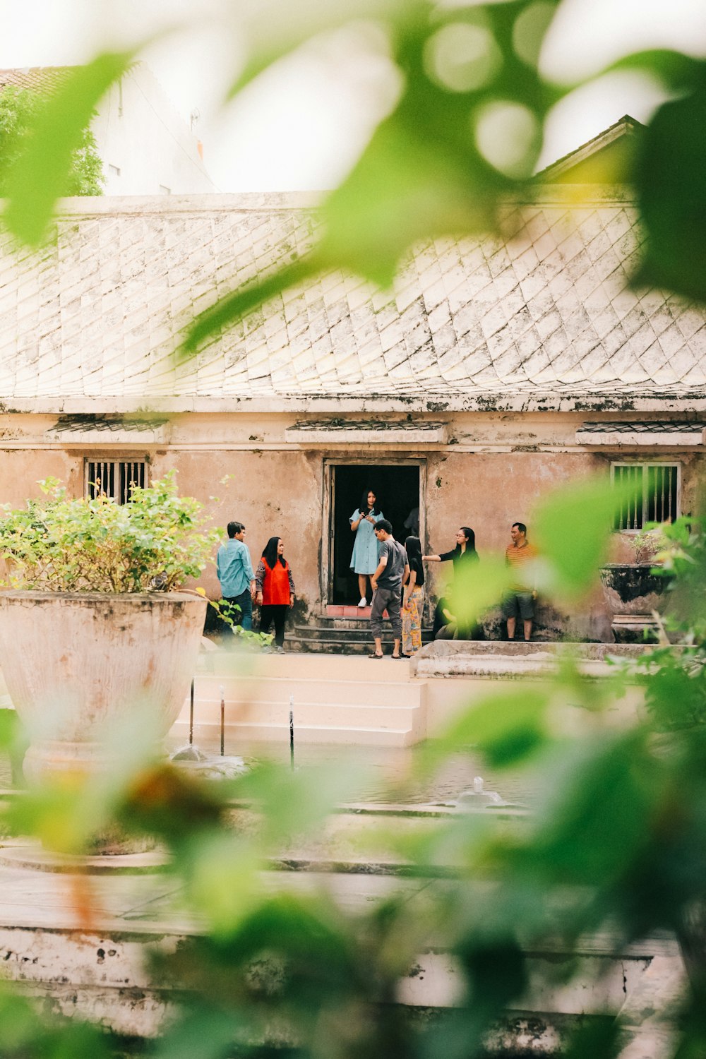 people walking on sidewalk near building during daytime