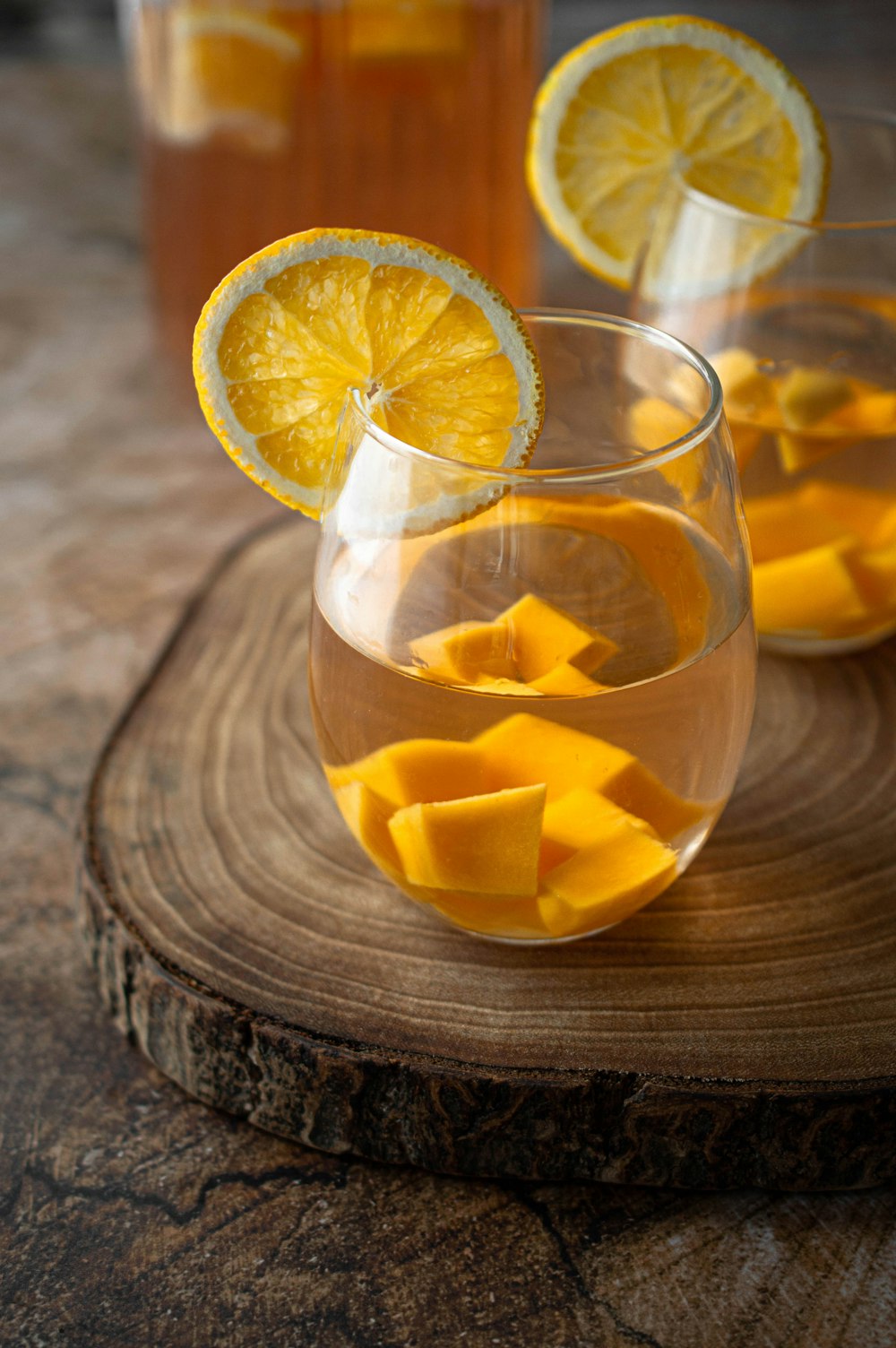 clear drinking glass with orange juice
