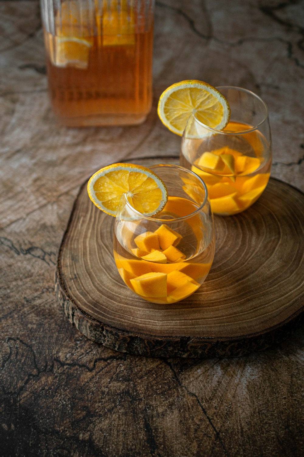 sliced lemon in clear drinking glass
