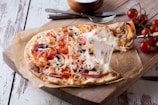 pizza on brown wooden tray