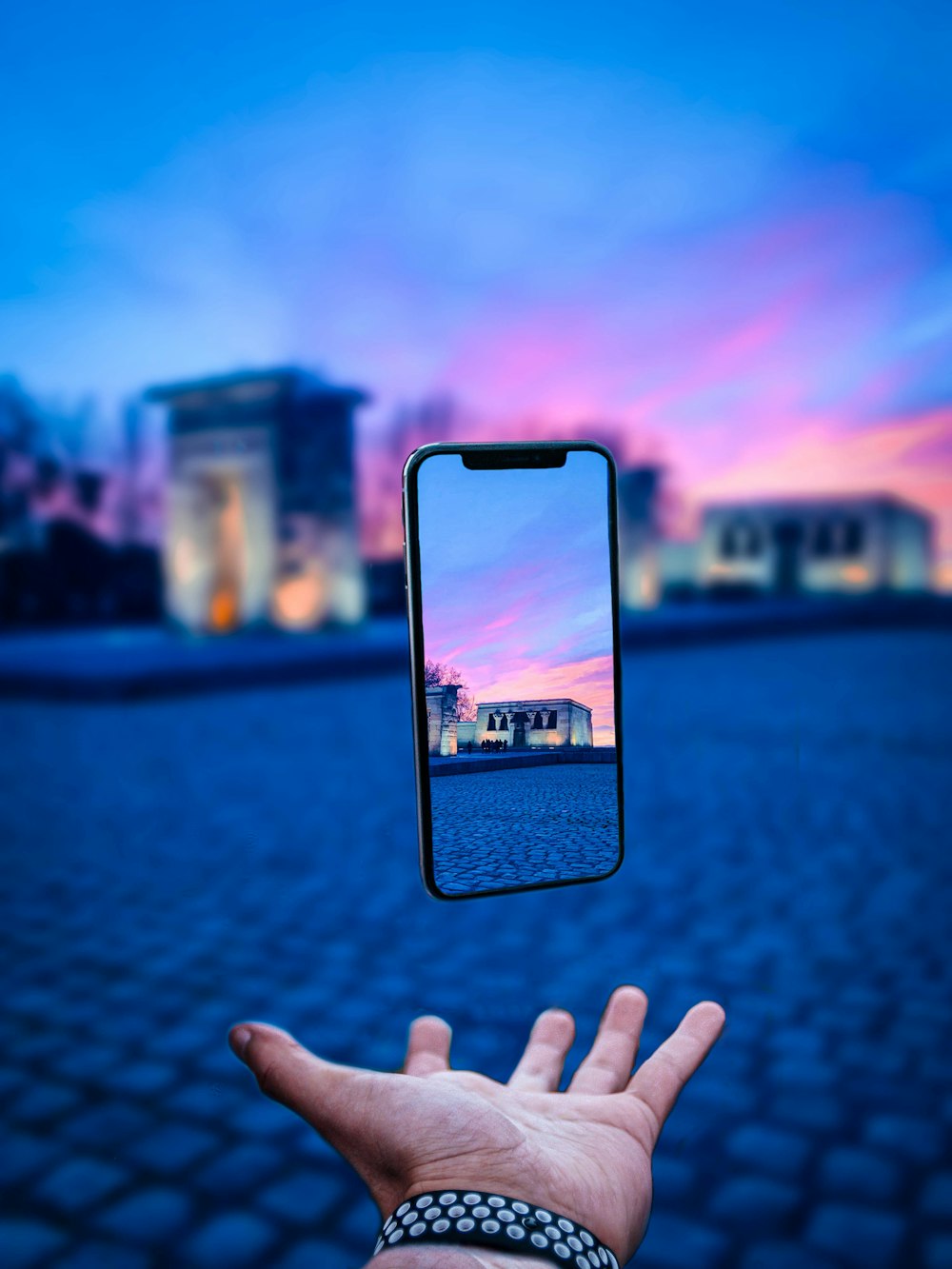 person holding black iphone 4