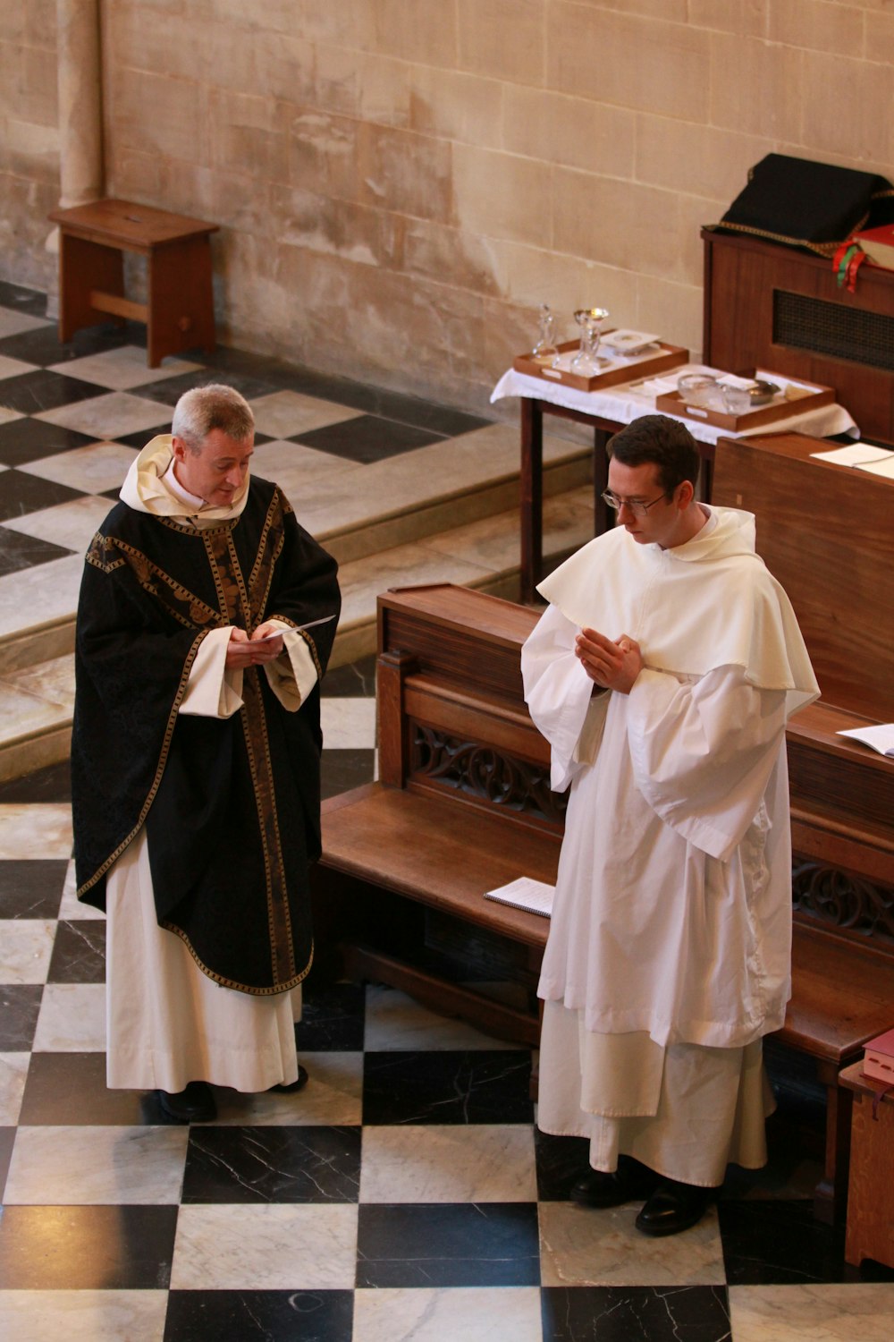 man in white thobe standing beside man in white thobe