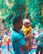 Happy Indian father holding his child outdoors after treatment.