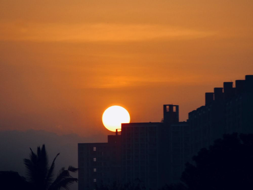 silhouette of building during sunset