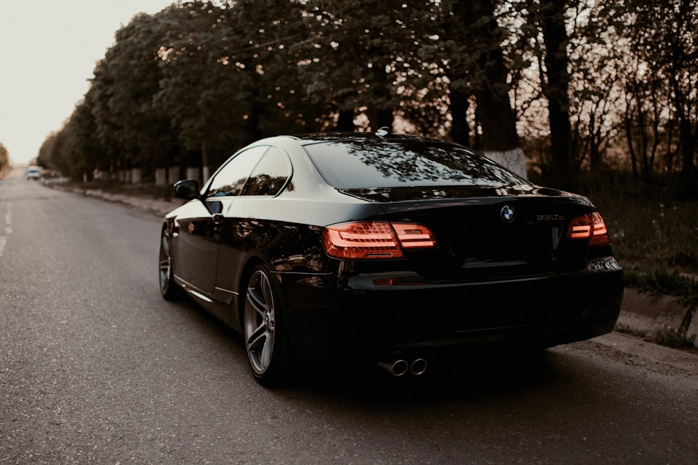 black honda sedan on road during daytime