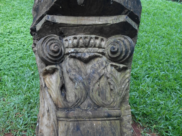 Close-up of a traditional Slovak linden leaf symbol carved in wood, symbolizing community and peace.
