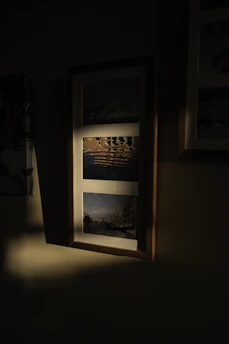 Close-up of a beautifully framed photograph hanging on a wall, showcasing expert image framing.