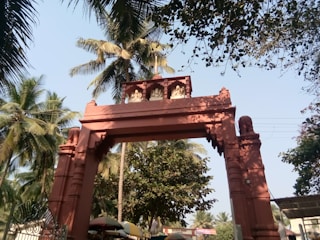 A vibrant floral archway welcoming visitors to Pooppoli Wayanad festival.