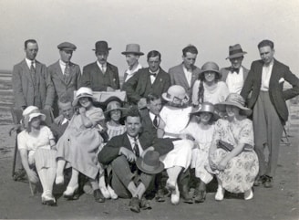 A group of diverse men dressed in casual and formal attire outdoors.
