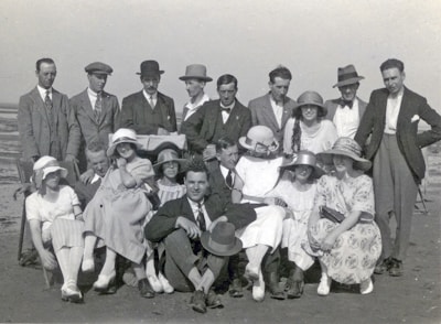 A diverse group of people wearing trendy and classic outfits outdoors.