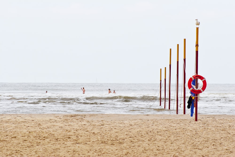 people surfing on sea waves during daytime