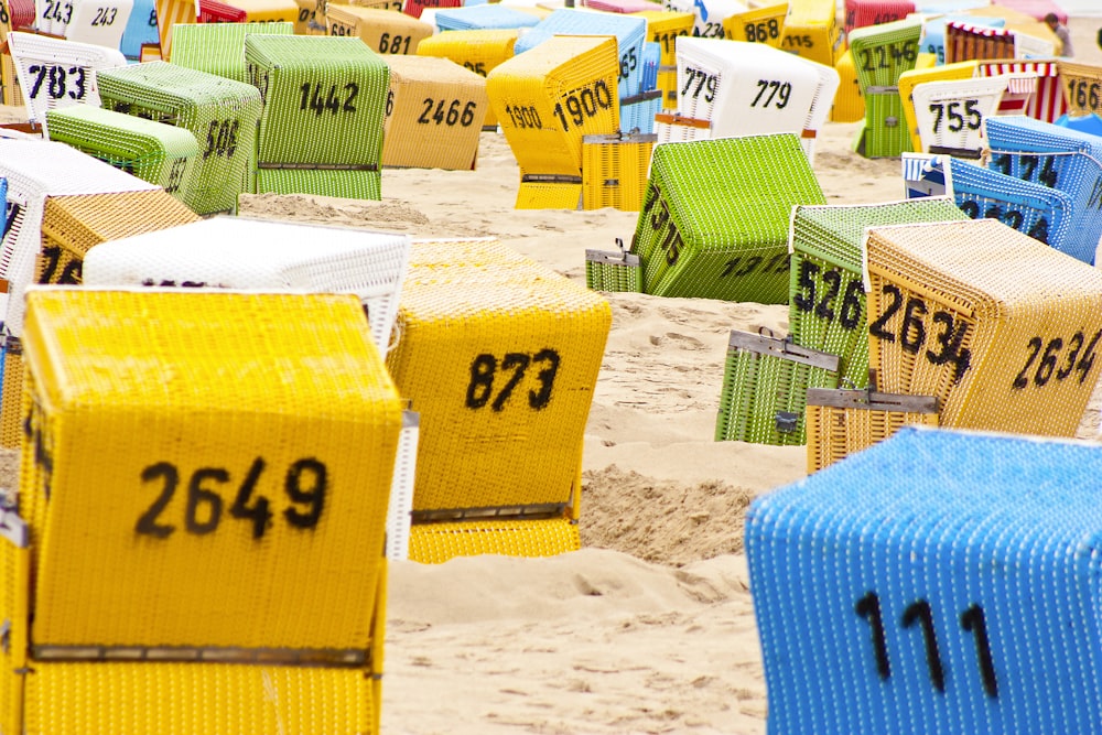 brown and green cardboard boxes on white sand